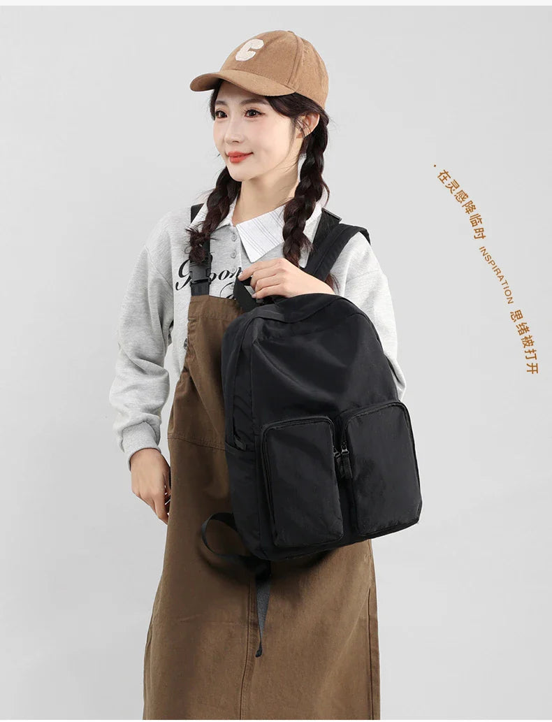 Water - resistant double - shoulder backpack. It has a large capacity, is lightweight and casual. Made of wrinkled and washed ny