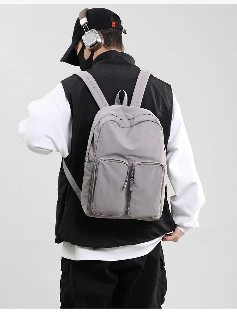 Water - resistant double - shoulder backpack. It has a large capacity, is lightweight and casual. Made of wrinkled and washed ny