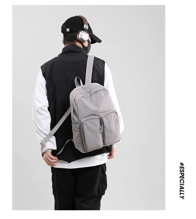 Water - resistant double - shoulder backpack. It has a large capacity, is lightweight and casual. Made of wrinkled and washed ny