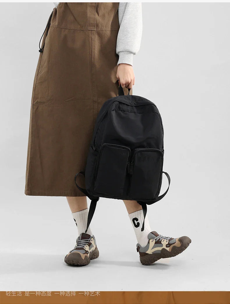 Water - resistant double - shoulder backpack. It has a large capacity, is lightweight and casual. Made of wrinkled and washed ny